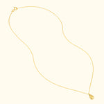 Delicate gold chain necklace with a teardrop-shaped pendant.