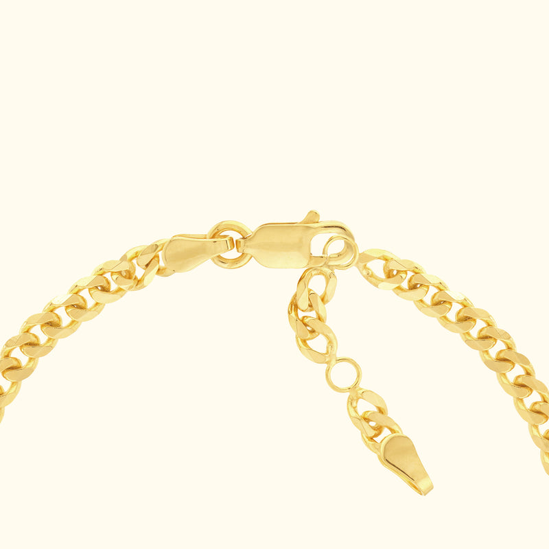 Gold chain bracelet with a secure clasp and adjustable length.