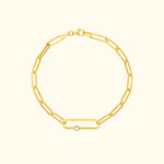 Gold link bracelet featuring a single diamond accent.