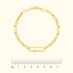 Gold chain bracelet with an oval link and a small diamond accent.