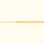 Thin gold chain necklace with alternating link styles on a light background.