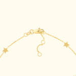 Gold bracelet with star charms and a clasp closure.