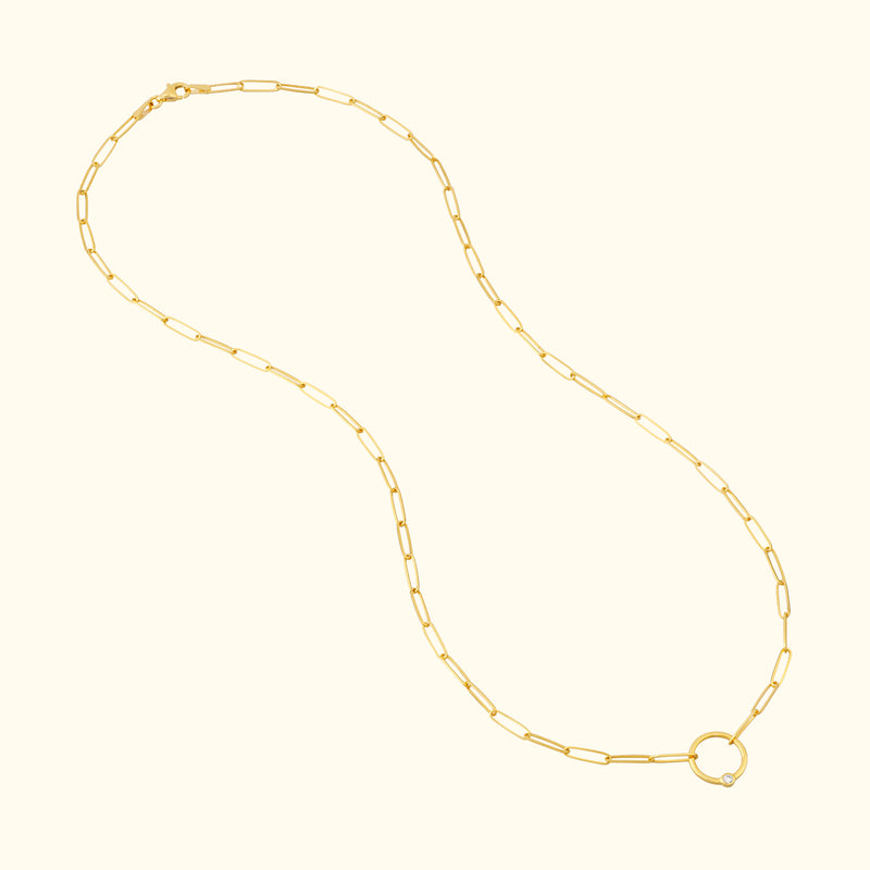 Gold chain necklace with elongated links and a round clasp.