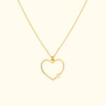 Gold heart pendant necklace with a small diamond accent.