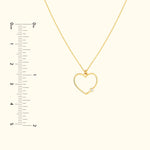 Golden heart-shaped necklace with a small diamond accent.