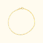 Gold chain bracelet with alternating polished and textured links.