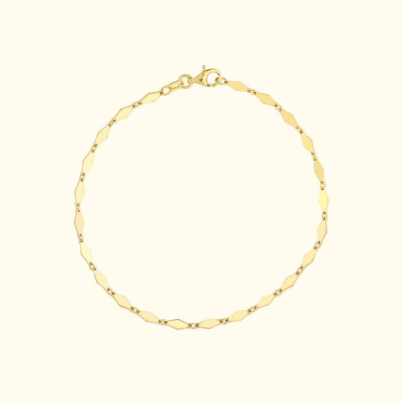 Gold chain bracelet with alternating polished and textured links.