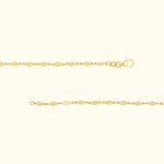 Elegant gold bracelet with diamond-shaped links and a lobster clasp.