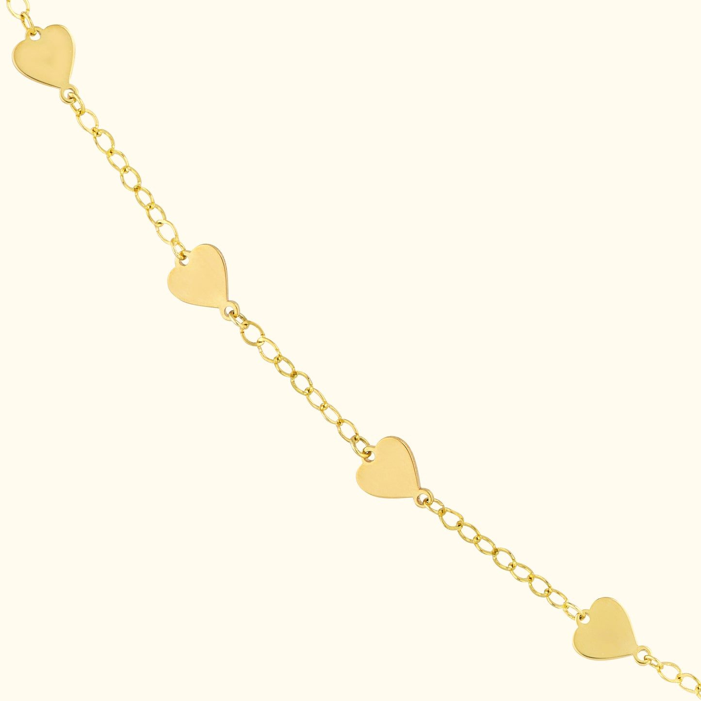 Gold chain bracelet featuring heart-shaped charms evenly spaced along the links.