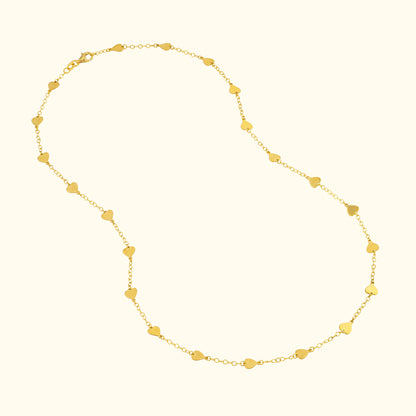 Gold necklace featuring a series of small heart-shaped links.