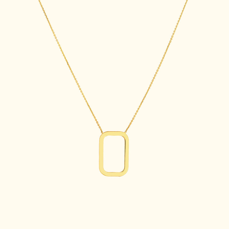 Gold necklace featuring a minimalist rectangular pendant on a delicate chain.