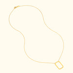 Delicate gold necklace with a rectangular pendant on a thin chain.