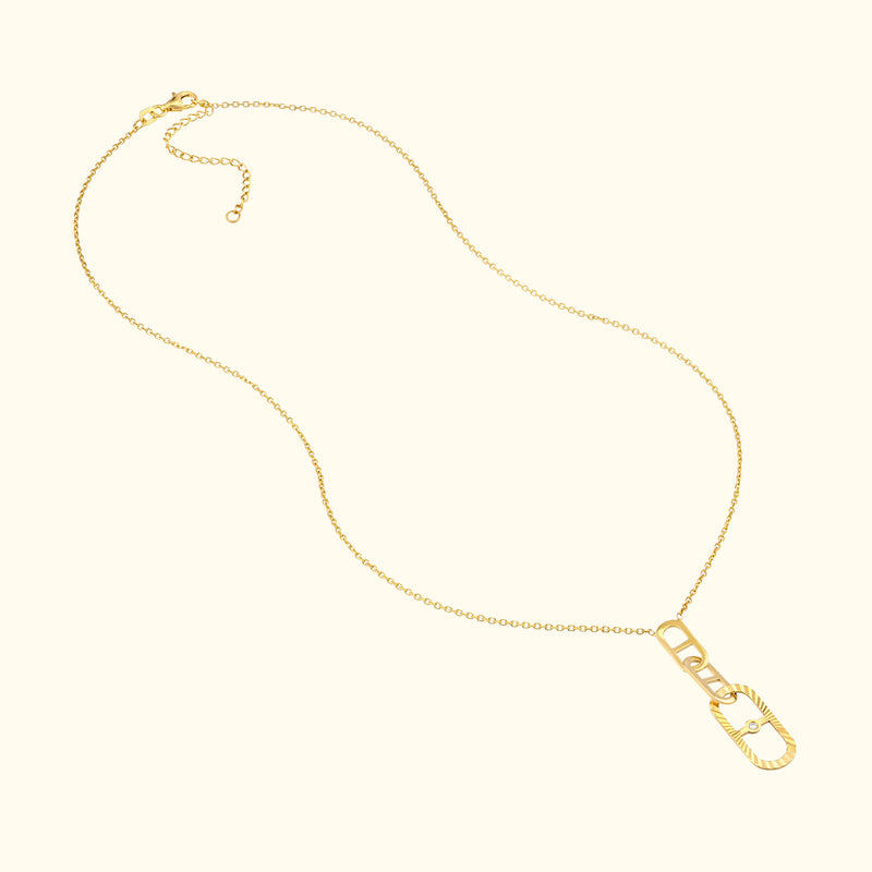 Gold chain necklace featuring an elongated link design.