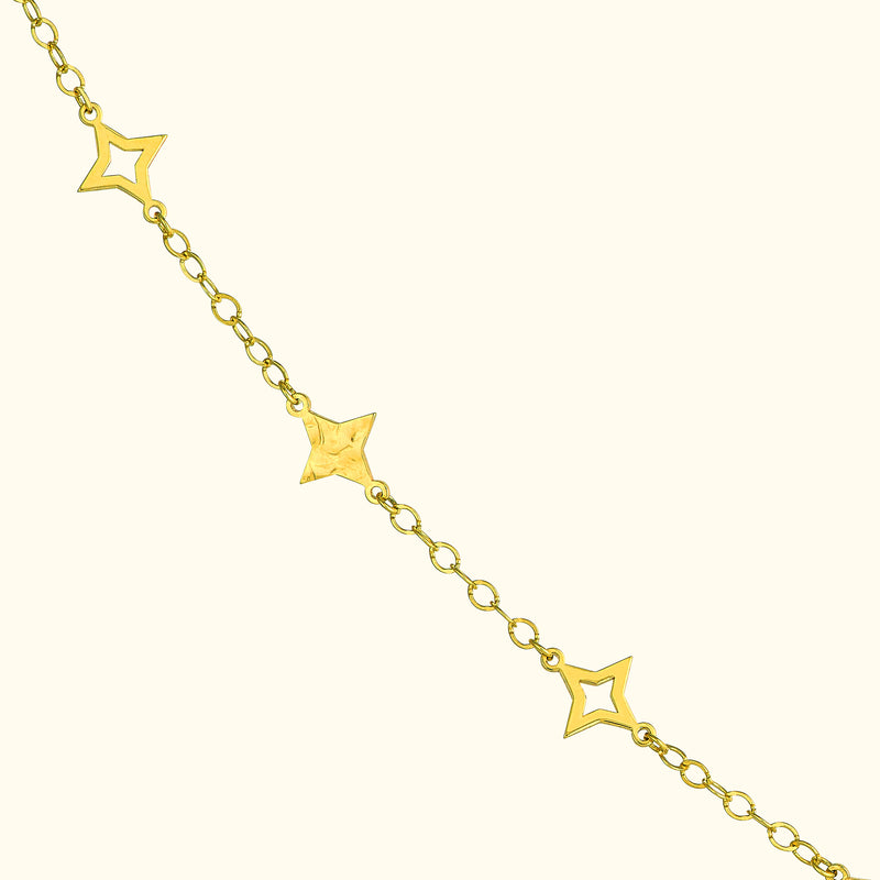 Gold chain bracelet with star-shaped links.