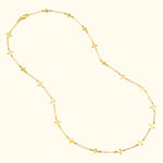 Gold necklace featuring star-shaped pendants along a delicate chain.