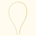 Delicate gold chain necklace with links and rounded ends.