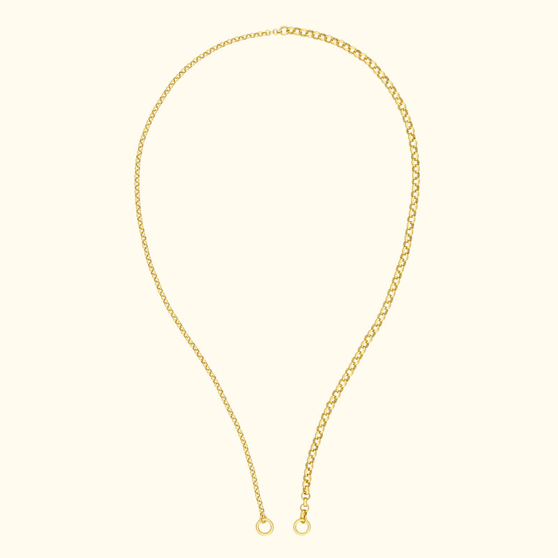 Delicate gold chain necklace with links and rounded ends.