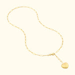Gold chain necklace with a heart-shaped pendant, featuring elongated links.
