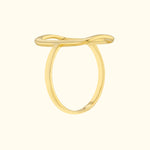 Minimalist gold ring with a smooth, wavy design.