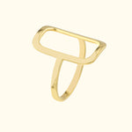 Minimalist gold ring with an open rectangular design.