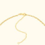 Gold chain necklace with a clasp and extension links.
