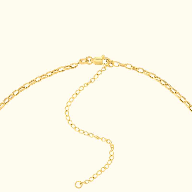 Gold chain necklace with a clasp and extension links.