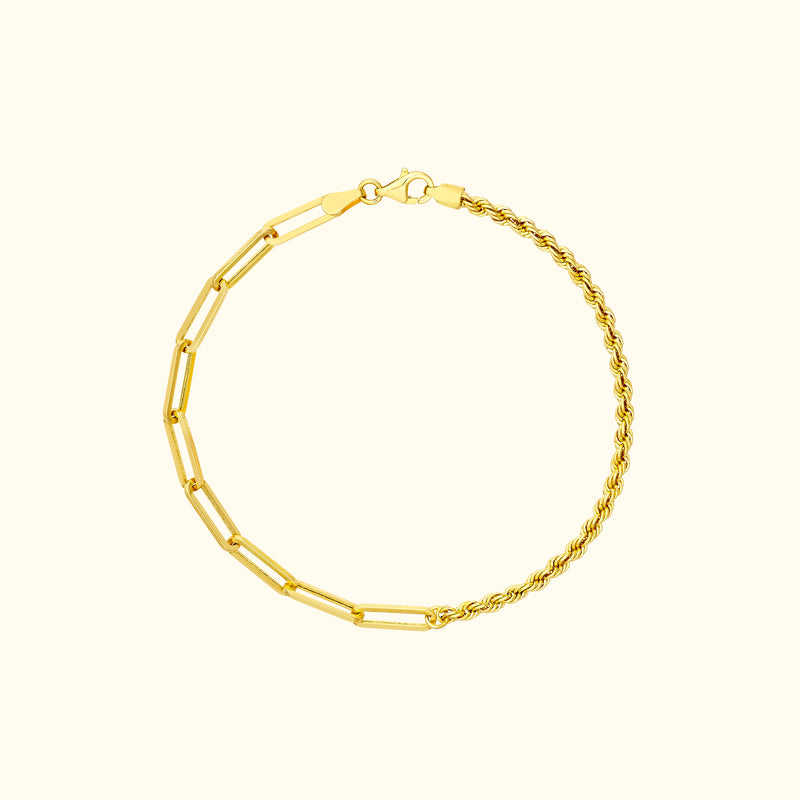 Gold bracelet with a mix of geometric links and twisted design.