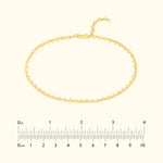 Gold bracelet with a zigzag design and adjustable clasp, displayed with a ruler for size.