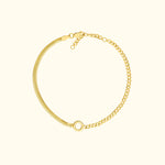 Gold bracelet featuring a mix of chain styles and a circular clasp.