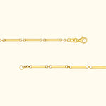Thin gold chain bracelet with rectangular links and a lobster clasp.