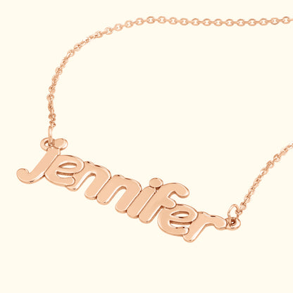 Rose gold necklace featuring the name "Jennifer" in a playful, cursive script.