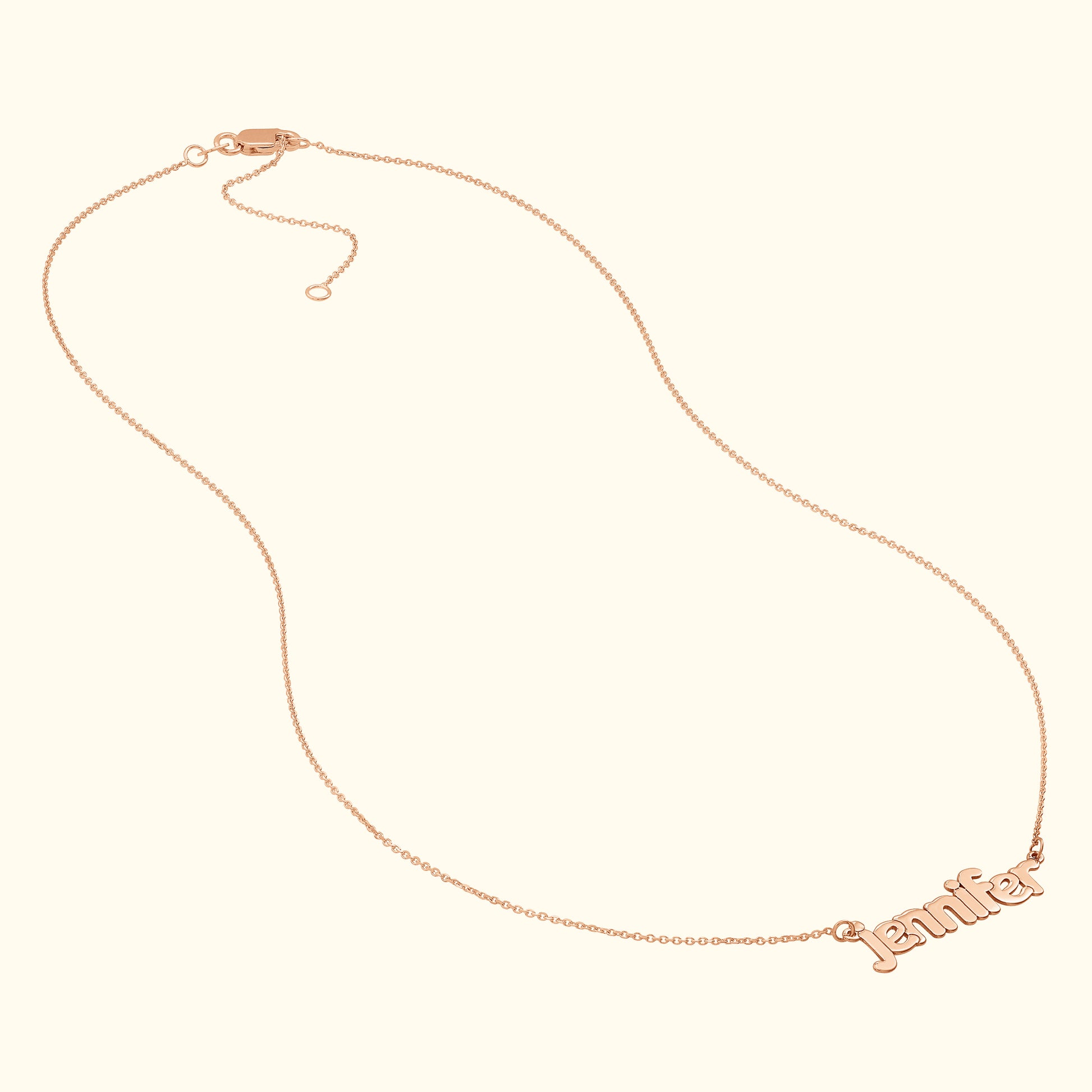 Rose gold necklace featuring the name "Jennifer" in a cursive font.