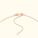 Rose gold chain necklace with a secure clasp and adjustable length.