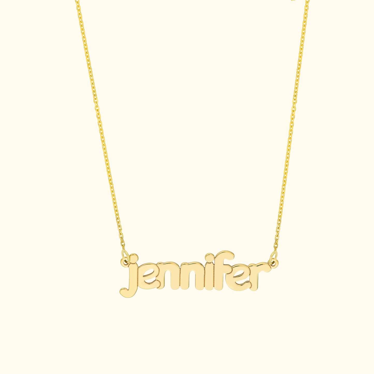 Gold necklace with the name "jennifer" in cursive letters.