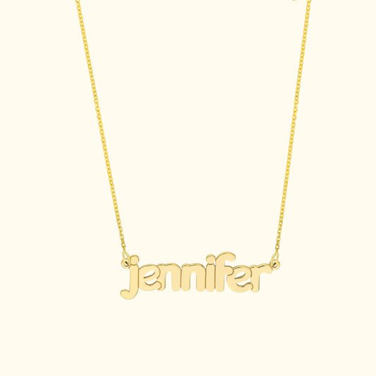 Gold necklace with the name "jennifer" in cursive letters.