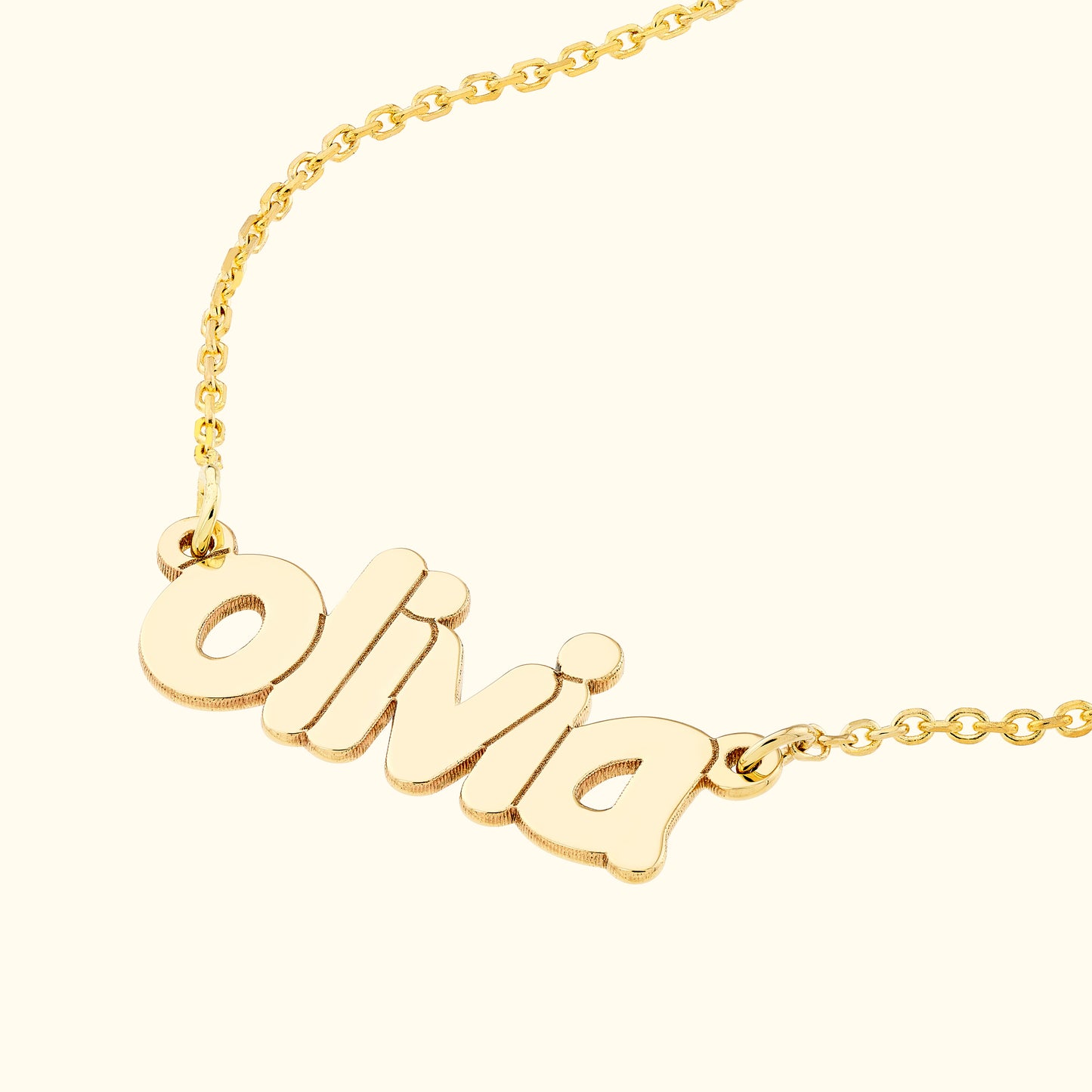 Gold necklace featuring the name "olivia" in cursive lettering.