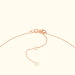 Rose gold chain necklace clasp with adjustable links.