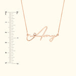 Rose gold name necklace featuring the name "Amy" with a small diamond accent.