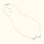 Silver necklace with a cursive letter "A" pendant.