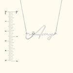 Silver name necklace with the word "Amy" and a small diamond accent.