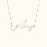 Silver necklace with a cursive name "Amy" and a small diamond accent.