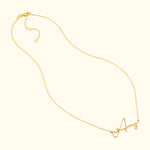 Gold necklace with a cursive letter "A" pendant.