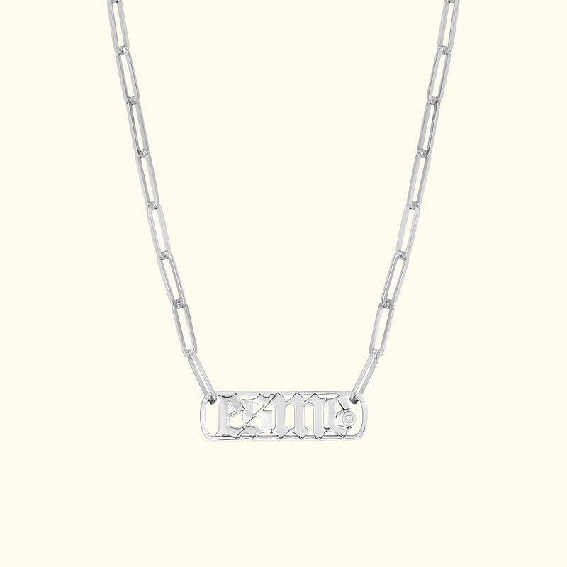 Silver chain necklace featuring an intricately designed pendant.