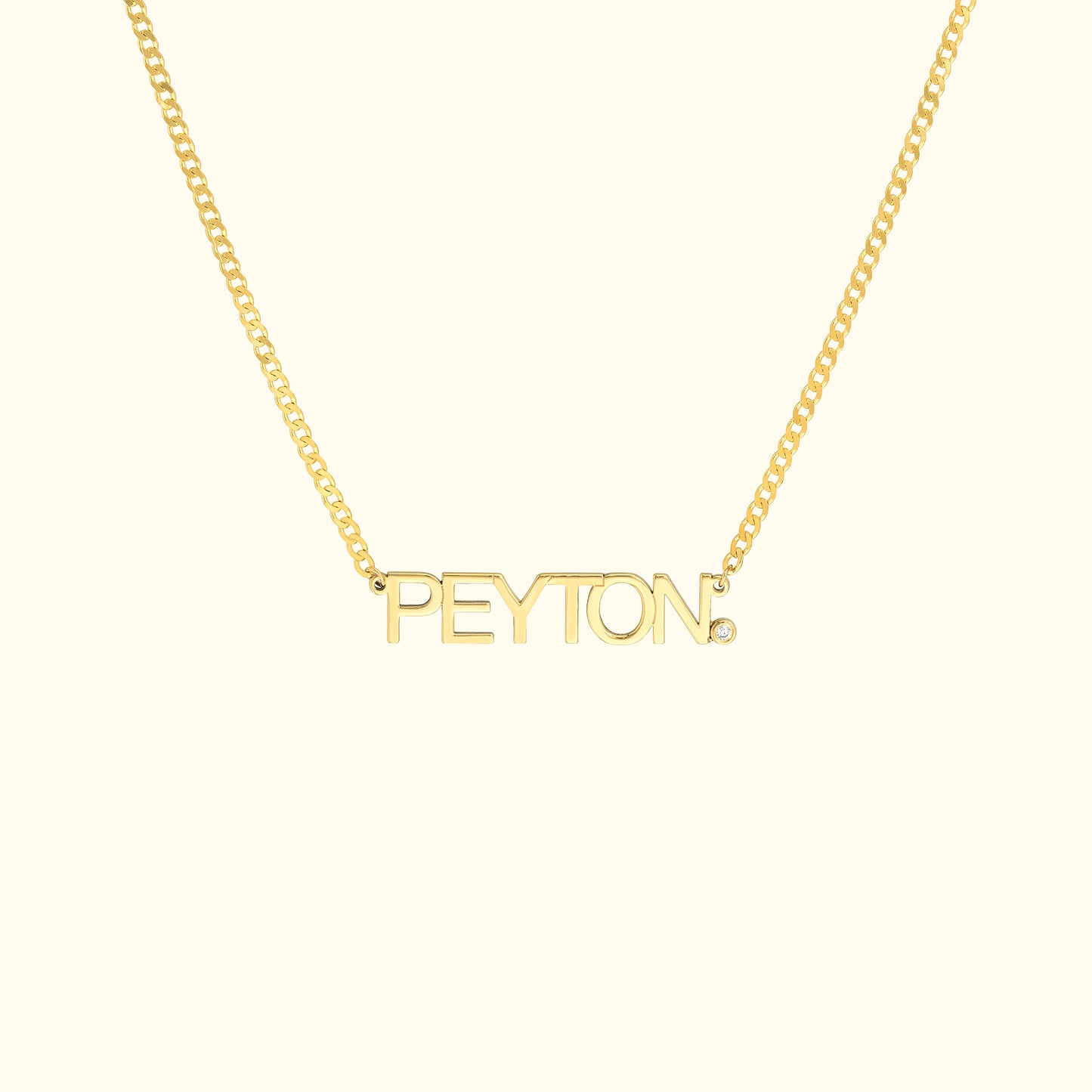 Gold necklace featuring the name "PEYTON" in bold letters.