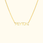 Gold necklace featuring the name "PEYTON" in bold letters.