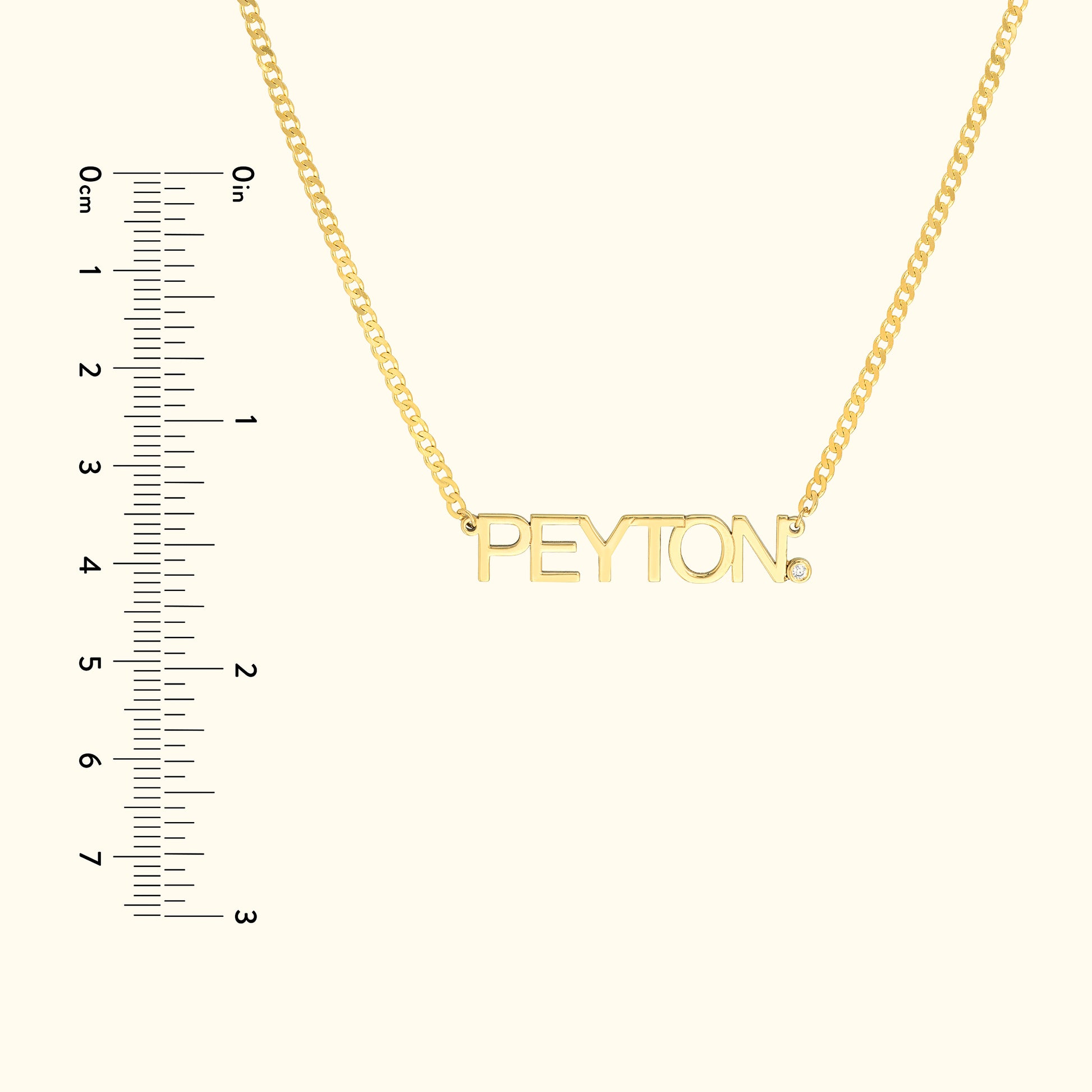 Gold necklace featuring the name "PEYTON" in bold letters, with a small diamond accent.