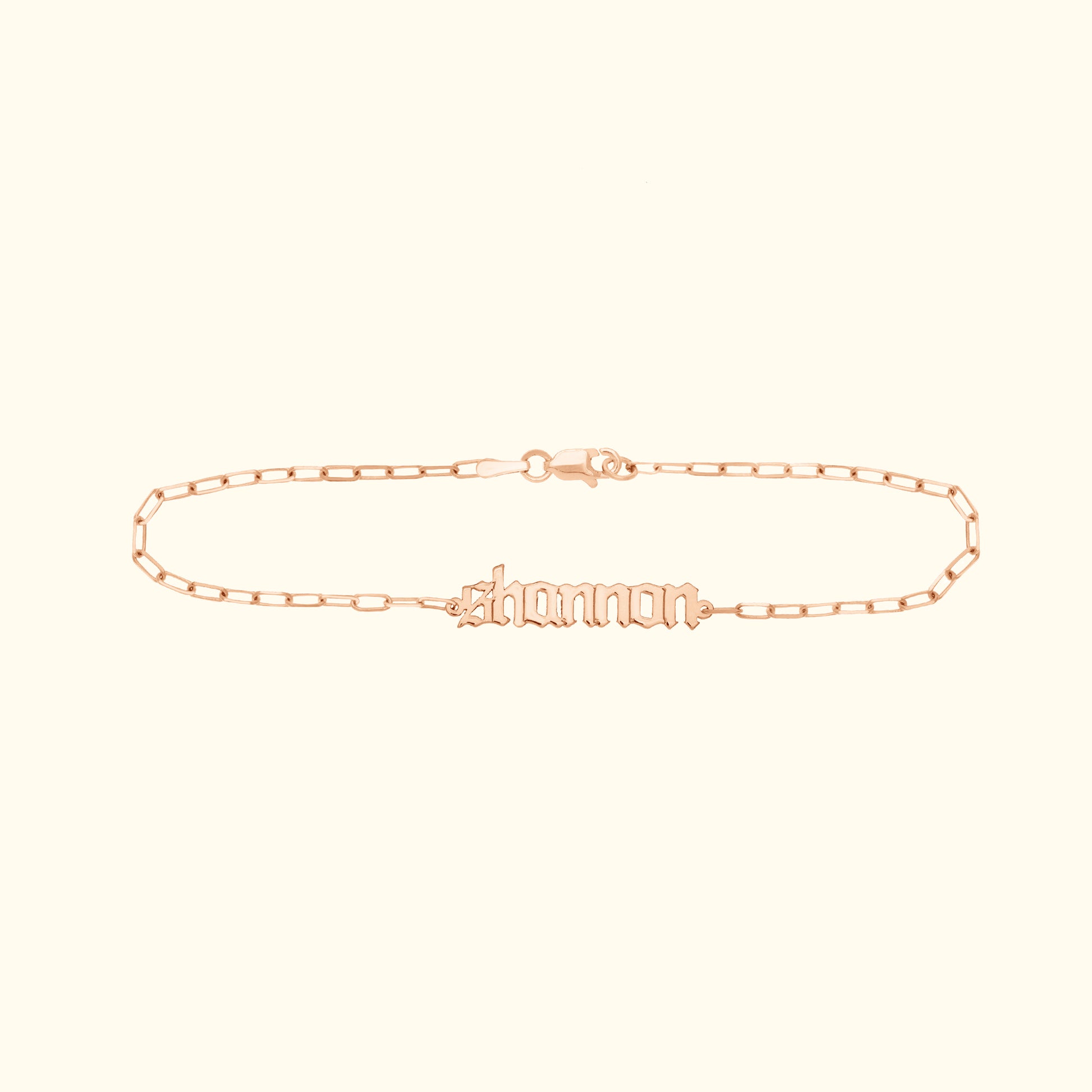 Personalized rose gold name bracelet with a chain link design.