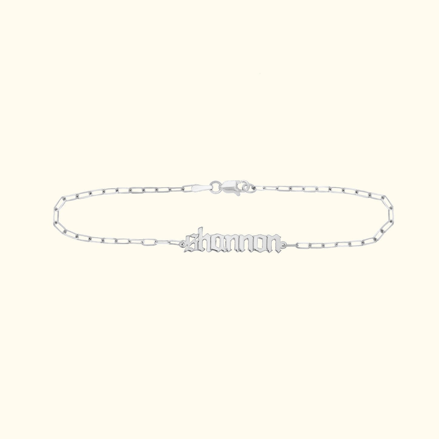 Silver name bracelet featuring the name "Shannon" in a decorative font.