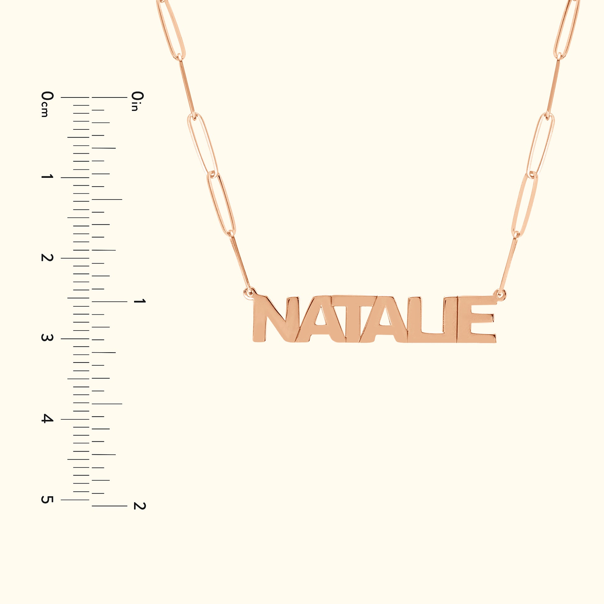 Rose gold necklace featuring the name "NATALIE" with a measurement scale on the side.