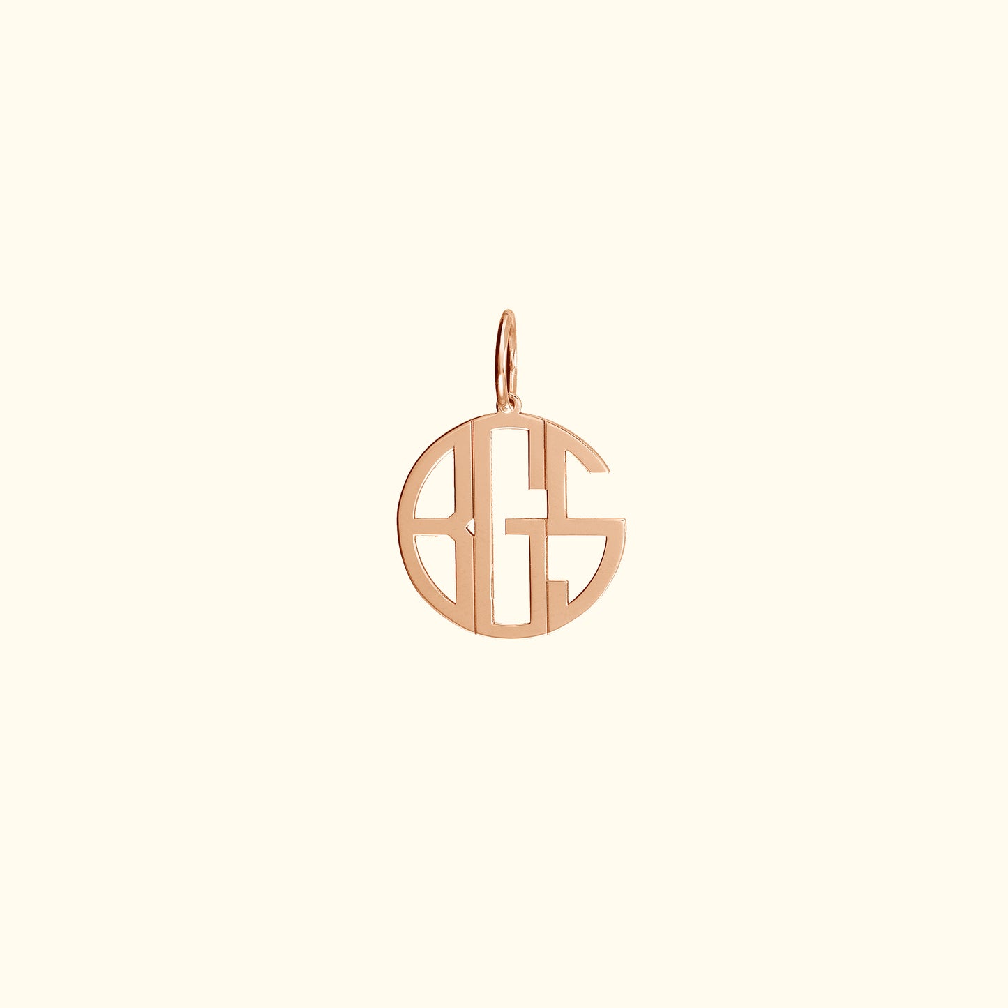 Rose gold monogram pendant in a circular design.